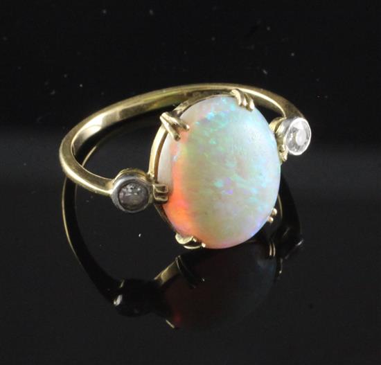 An 18ct gold, white opal and diamond ring, size I.